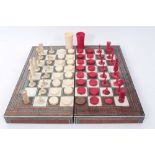 Collection of 19th century ivory and stained ivory chess and draughts pieces, the tallest 9cm and