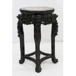 Late 19th/early 20th century Chinese carved hardwood and marble inset urn stand, with octagonal