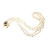 A double strand of cultured pearls with gold clasp