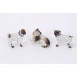 Two 19th century Meissen pug dogs, together with Meissen style cat (3)
