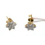 Pair of diamond cluster earrings, each flower head cluster with 7 brilliant cut diamonds in 18ct