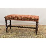 Victorian walnut long stool, floral damask upholstery on barley-twist supports and castors