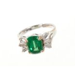 Green garnet and diamond cocktail ring with a cushion cut green tsavorite garnet weighing