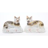 Good pair of 19th century Staffordshire sponge-decorated models of recumbent cats