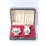 Contemporary silver milk jug and sugar bowl in fitted case