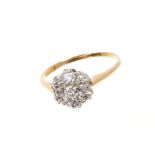 Diamond cluster ring with a flower head cluster of seven old cut diamonds in claw setting on 18ct