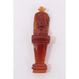 Antique amber carving of an Egyptian figure