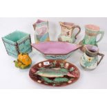 Collection of 19th century majolica, to include a dish depicting a fish and other creatures, jugs,