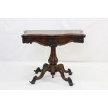 Victorian rosewood serpentine fronted card table standing on central column with four scroll