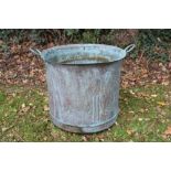 Copper vessel, cylindrical with everted rim , twin handles, 53cm diameter, together with squat