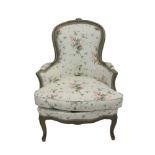 Antique French painted easy chair with floral upholstery