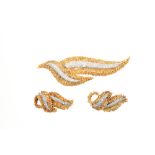 1960s 18ct gold and diamond brooch and matching ear clips of abstract organic leaf form with pavé