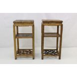 Pair of antique Chinese elm urn stands together with a pair of antique Chinese window panels