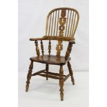 Victorian elm Windsor stick back elbow chair on turned legs