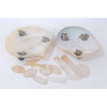 Pair of Chinese engraved mother-of-pearl dishes with white metal mounts, together with mother of