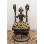 Mesopotamian style ornate carved hardwood elbow chair. Provenance: Removed from Gilgamesh