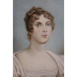 19th century English school portrait miniature in ivory - a young lady in white dress, in gilt