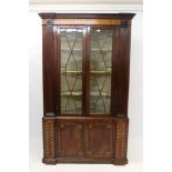 Fine George III mahogany and parquetry inlaid standing corner cupboard of narrow form, with dentil