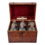 Late 18th/early 19th century Continental mahogany decanter box with gilt decorated bottles