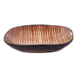 18th century English earthenware slipware baking dish, with combed slip decoration and a notched