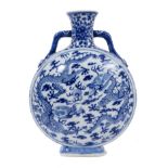Chinese blue and white porcelain moon flask, painted with dragons chasing a flaming pearl