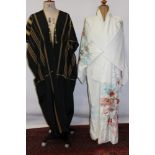 Japanese embroidered Kimono plus a black and gold woven African dress
