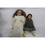 Two Dolls including a small French doll SPBJ 60 Paris with composite body and limbs.