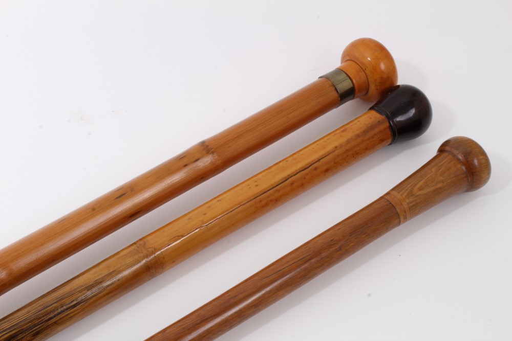 Late 19th/early 20th century stepped Malacca walking stick with metal collar and roundel handle