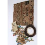 Regency silk purse, George III sampler, collection of turned silk bobbins