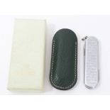 Rolex stainless steel penknife with Rolex logo design, in green leather pouch and outer box