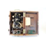 An early 20th century naval theodolite in original fitted mahogany case with brass mounts, named to