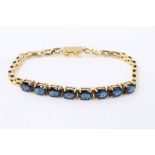 Gold (stamped 14k) synthetic blue sapphire bracelet