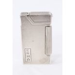 Dunhill silver cigarette lighter with 1953 Coronation hallmarks and engine turned decoration,