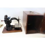 Antique sewing machine in mahogany case