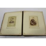 Two Victorian bound scrap books, one other later and leather bound photo album