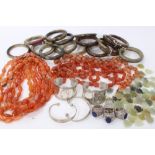 Group of jewellery to include Chinese green stone bangles, four white metal and lapis lazuli dress