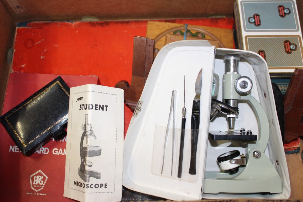 Student microscope, 1920s notebooks, various vintage games
