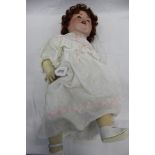 Doll Armand Marseille 996 A11M. Bisque head, blue sleeping eyes, open mouth top two teeth showing.