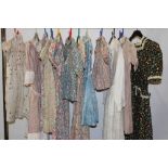 A collection of mainly 1930's - 50's girls Liberty print dresses and smocks.