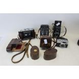 Assorted vintage cameras and lights