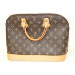 Louis Vuitton Monogram Canvas Handbag with leather handles and base. FL00811