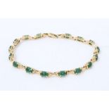 Gold (stamped 585) jade/ green hardstone cabochon bracelet