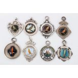 Group of eight antique enamelled silver canary and other birding club medals