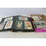 Postcard albums together with loose cards, including fairies ,bonzo x4, Louis Wain,