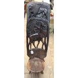 Old African carved hardwood chair with lion and antelope decoration