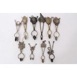 Collection of 10 antique Victorian and later ladies' skirt lifters, including ones with floral