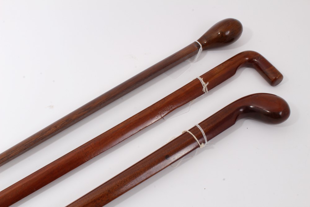 Three unusual early 20th century walking sticks made form aeroplane propellers with carved handles