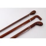 Three unusual early 20th century walking sticks made form aeroplane propellers with carved handles