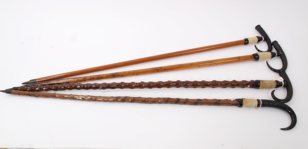 Four Alpine walking sticks with Ibex horn handles and spiked ferrules, one inscribed "Interlaken" - Image 2 of 6