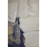 A selection of table linens with lace-work including crochet, bobbin lace and cut-out work. Plus an